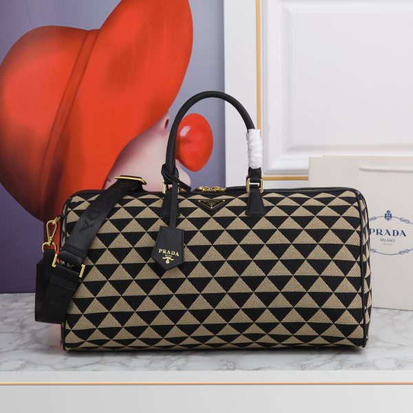 Medium Symbole embroidered fabric travel bag