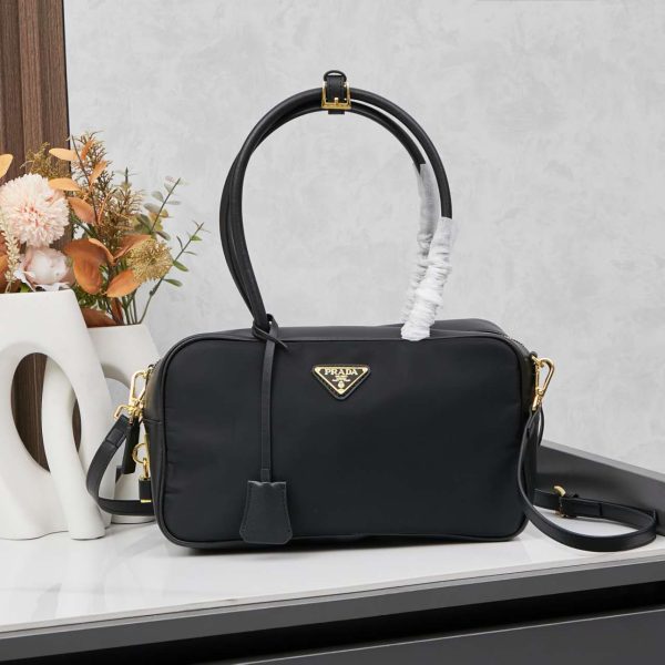 Re-Nylon and leather medium top-handle bag with padlock