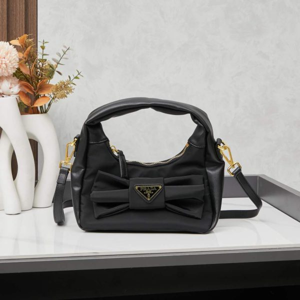 Re-Nylon and nappa leather mini-bag with bow